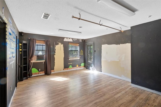 70 Hyacinth Dr, Covington, LA 70433 - unfurnished room with wood finished floors, a textured ceiling, and baseboards