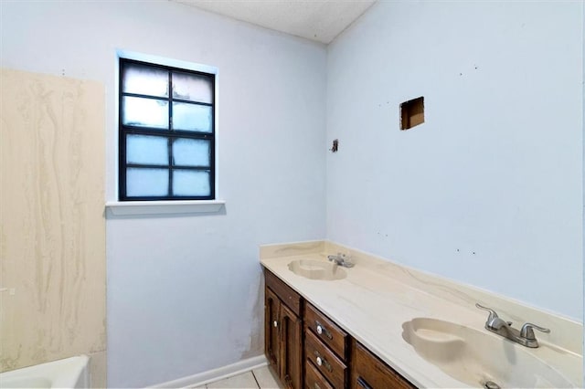 70 Hyacinth Dr, Covington, LA 70433 - bathroom featuring double vanity and tile patterned floors