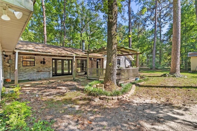 70 Hyacinth Dr, Covington, LA 70433 - rear view of property featuring french doors and brick siding