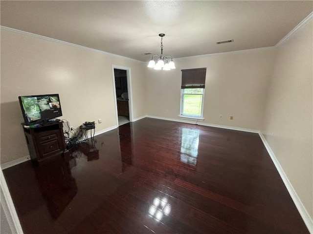 45246 Morris Rd, Hammond, LA 70401 - unfurnished dining area featuring wood-type flooring, a chandelier, crown molding, and baseboards