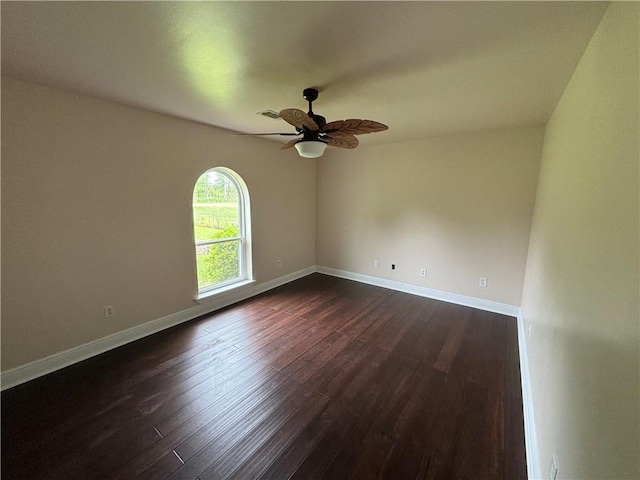 45246 Morris Rd, Hammond, LA 70401 - spare room with dark wood finished floors, ceiling fan, and baseboards
