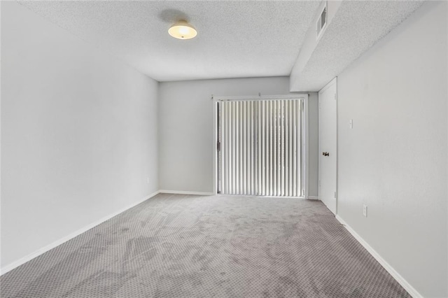 2912 Manhattan Blvd Unit 133, Harvey, LA 70058 - empty room with carpet, baseboards, and a textured ceiling
