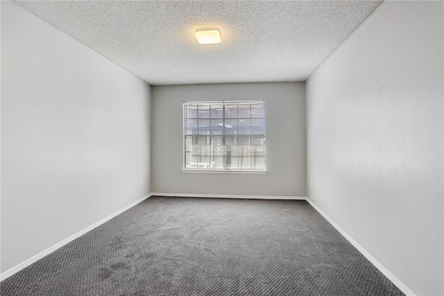 2912 Manhattan Blvd Unit 133, Harvey, LA 70058 - unfurnished room with carpet, a textured ceiling, and baseboards