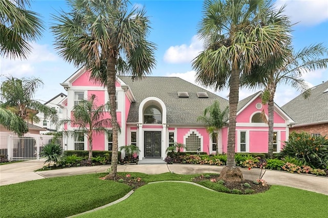 3805 3rd St, Metairie, LA 70002 - mediterranean / spanish home featuring curved driveway and stucco siding