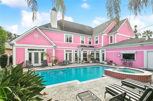 3805 3rd St, Metairie, LA 70002 - view of swimming pool featuring a patio area, french doors, and a pool with connected hot tub