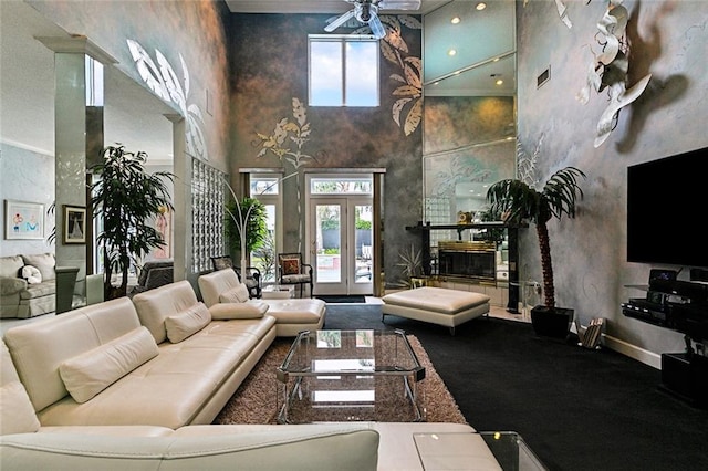 3805 3rd St, Metairie, LA 70002 - living room featuring a high ceiling, a ceiling fan, and baseboards