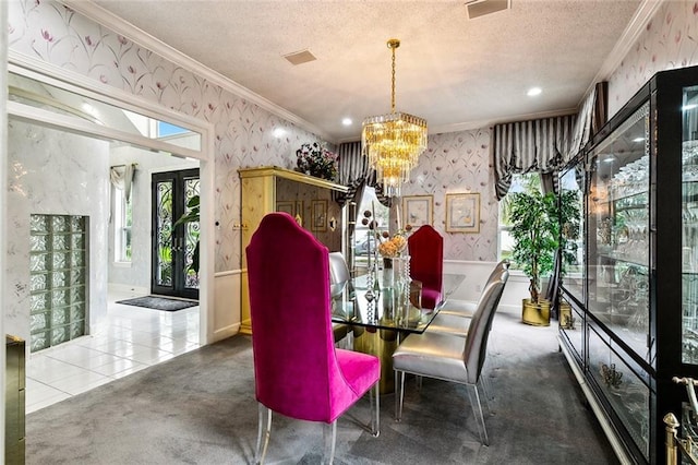 3805 3rd St, Metairie, LA 70002 - dining room with wallpapered walls, ornamental molding, a chandelier, a textured ceiling, and french doors