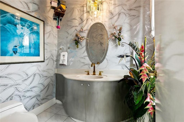 3805 3rd St, Metairie, LA 70002 - bathroom with wallpapered walls, toilet, tile patterned flooring, and vanity
