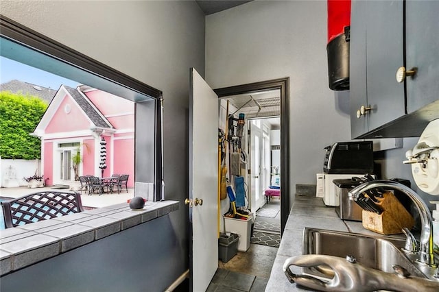 3805 3rd St, Metairie, LA 70002 - kitchen with tile counters, a sink, and healthy amount of natural light