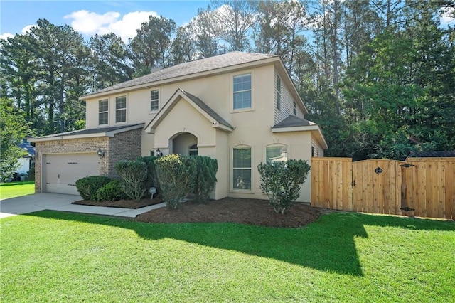 traditional-style home with stucco siding, driveway, a gate, an attached garage, and a shingled roof