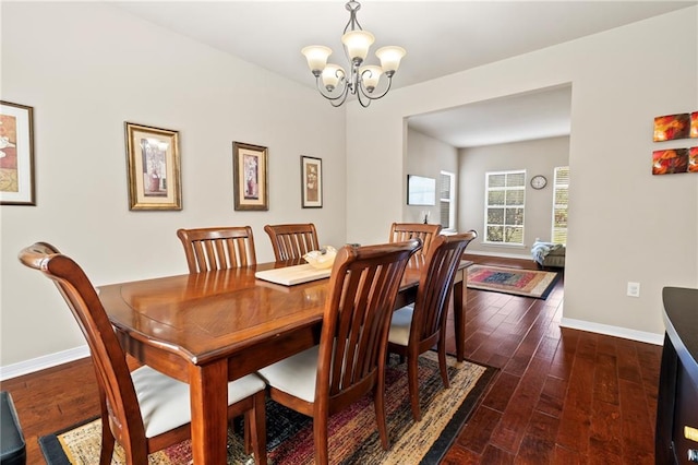 204 Autumn Woods Dr, Lacombe, LA 70445 - dining space with a chandelier, baseboards, and dark wood-style flooring