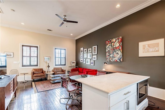 office featuring ceiling fan, dark wood-type flooring, crown molding, baseboards, and recessed lighting