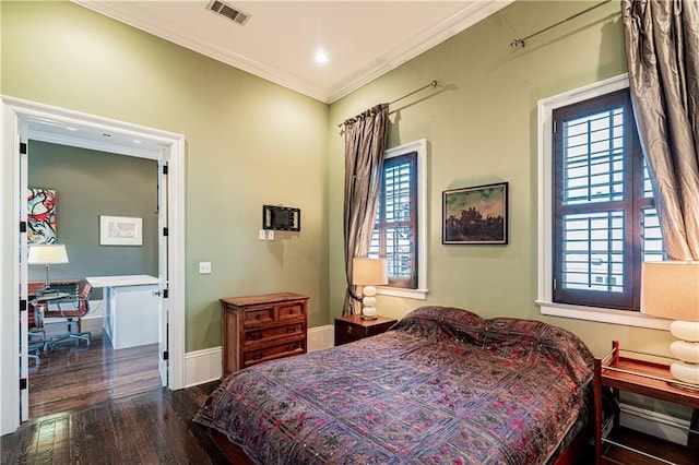 bedroom with wood finished floors, crown molding, a desk, and baseboards