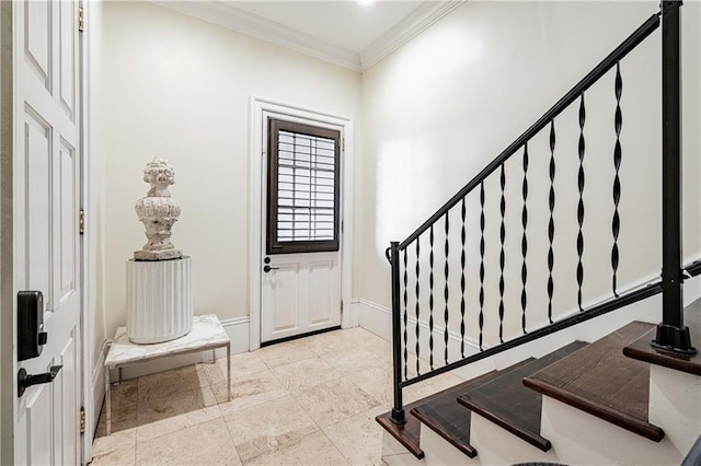 foyer with ornamental molding, stairway, and baseboards