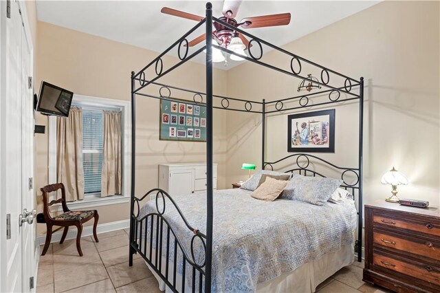 5805 Argonne Blvd, New Orleans, LA 70124 - bedroom featuring light tile patterned flooring, baseboards, and ceiling fan