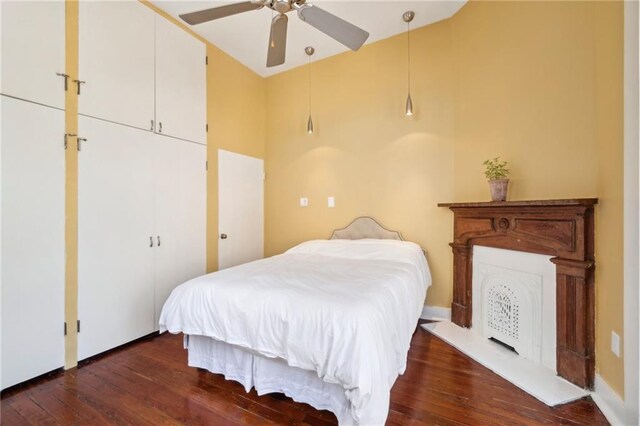 bedroom featuring hardwood / wood-style floors and ceiling fan