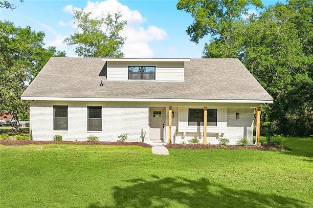 2004 Bluebird St, Slidell, LA 70460 - view of front of property with brick siding, covered porch, a front lawn, and a shingled roof