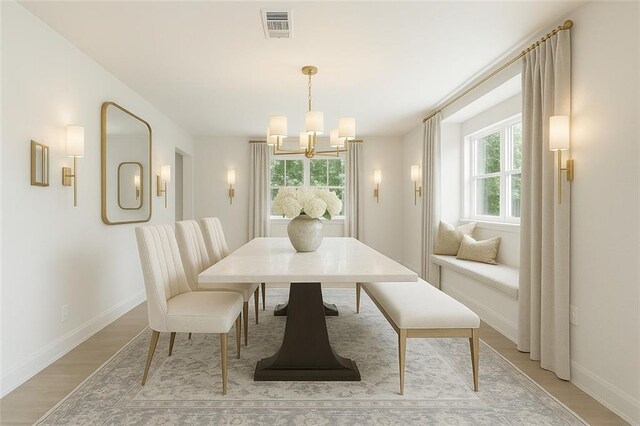 2004 Bluebird St, Slidell, LA 70460 - dining area featuring a chandelier, light wood finished floors, and baseboards