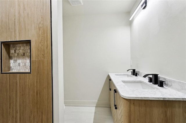 2004 Bluebird St, Slidell, LA 70460 - full bathroom featuring baseboards and double vanity