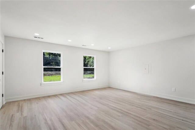 2004 Bluebird St, Slidell, LA 70460 - empty room with light wood-style floors, recessed lighting, and baseboards