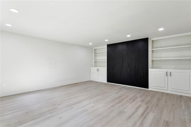 2004 Bluebird St, Slidell, LA 70460 - unfurnished living room featuring light wood finished floors, recessed lighting, baseboards, and built in shelves