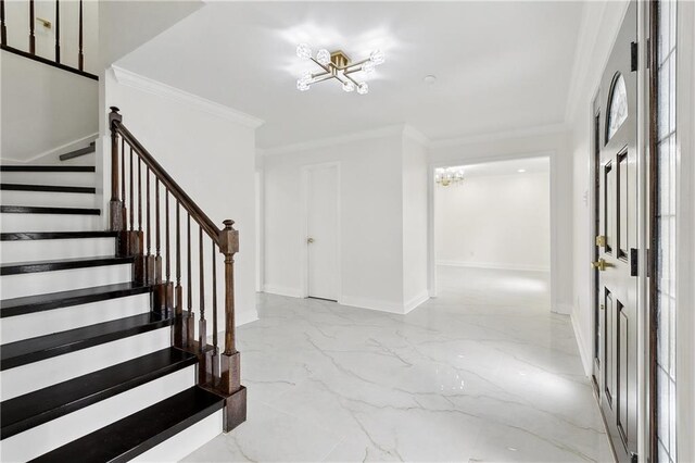 27 Yellowstone Dr, New Orleans, LA 70131 - entrance foyer with a chandelier, marble tiled flooring, stairway, ornamental molding, and baseboards