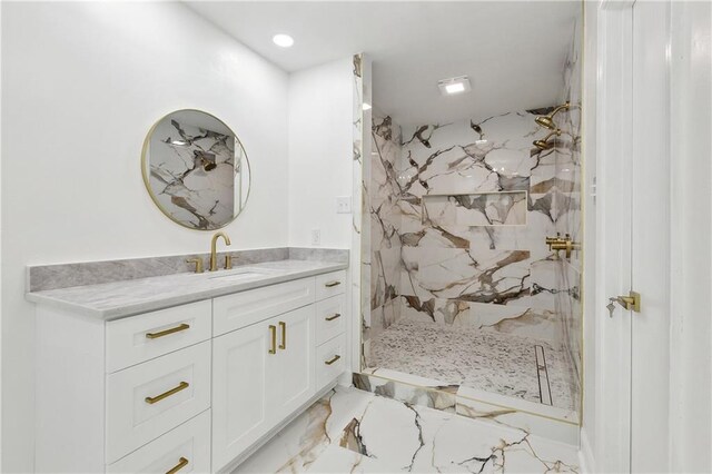 27 Yellowstone Dr, New Orleans, LA 70131 - bathroom with marble tiled flooring, a marble finish shower, vanity, and recessed lighting