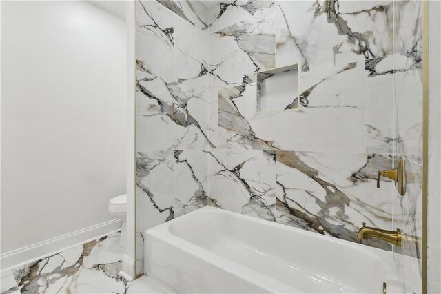 27 Yellowstone Dr, New Orleans, LA 70131 - bathroom featuring toilet, washtub / shower combination, baseboards, and marble finish floors