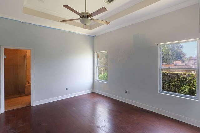 5106 Baccich St, New Orleans, LA 70122 - empty room with ceiling fan, wood finished floors, baseboards, and a tray ceiling