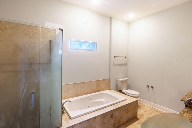 5106 Baccich St, New Orleans, LA 70122 - bathroom featuring a stall shower, a jetted tub, and toilet