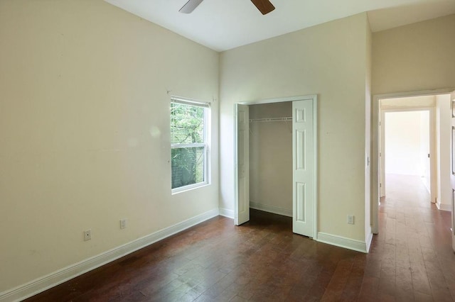 5106 Baccich St, New Orleans, LA 70122 - unfurnished bedroom featuring dark wood-style flooring, a closet, baseboards, and ceiling fan
