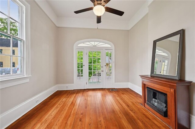 538 Verret St, New Orleans, LA 70114 - unfurnished living room with plenty of natural light, wood-type flooring, and a fireplace