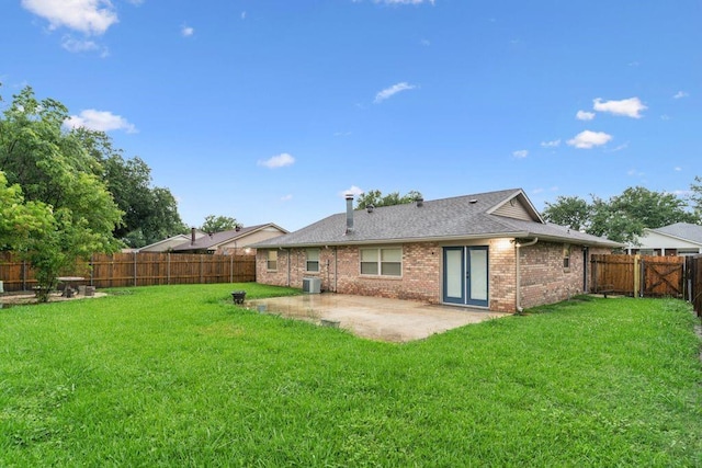 back of property featuring a patio area, brick siding, roof with shingles, and central AC unit