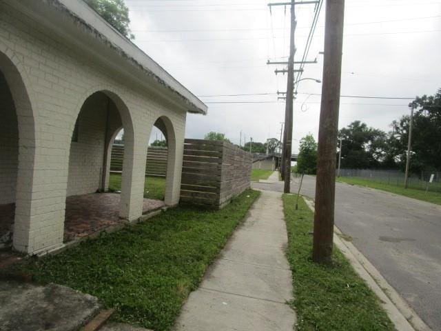 4701 Marais St, New Orleans, LA 70117 - view of asphalt road featuring sidewalks and curbs