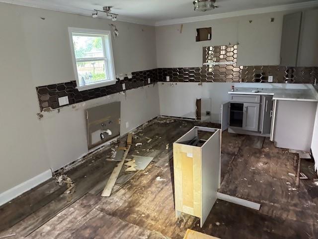 4701 Marais St, New Orleans, LA 70117 - kitchen with ornamental molding, tasteful backsplash, and gray cabinets