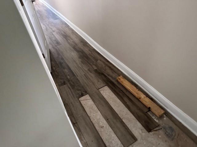 4701 Marais St, New Orleans, LA 70117 - detailed view of baseboards and wood finished floors