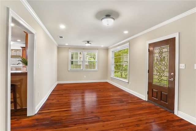 foyer entrance with wood finished floors, ornamental molding, baseboards, and recessed lighting