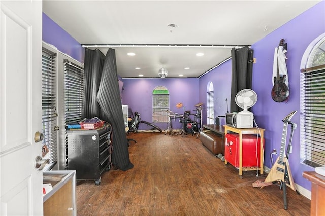 recreation room featuring wood finished floors and recessed lighting