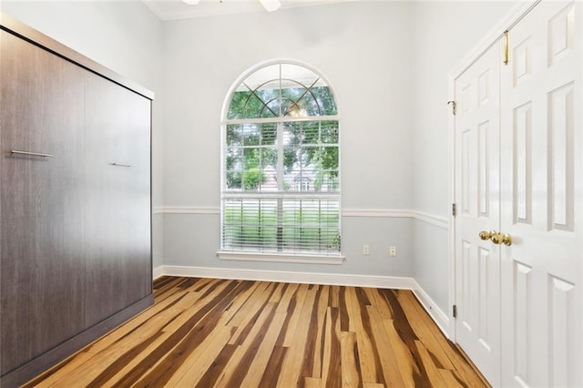 1306 Woodmere Dr, Mandeville, LA 70471 - unfurnished bedroom with wood finished floors and baseboards