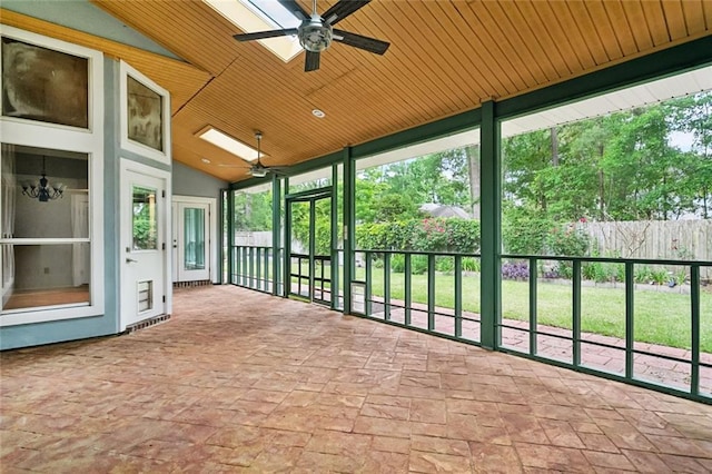 1306 Woodmere Dr, Mandeville, LA 70471 - unfurnished sunroom with a ceiling fan, lofted ceiling, and a skylight