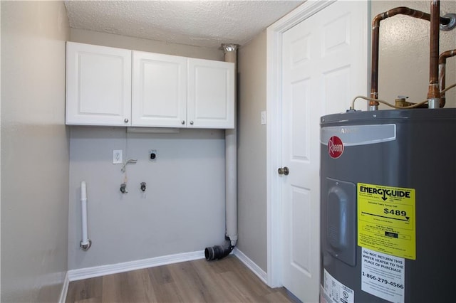 utility room featuring water heater