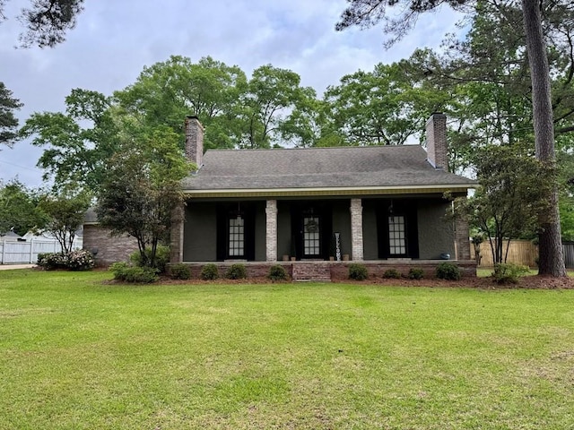 208 Noble Dr, Brookhaven, MS 39601 - view of front facade featuring a chimney, brick siding, and a shingled roof