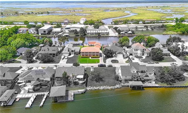 aerial perspective of suburban area with a large body of water