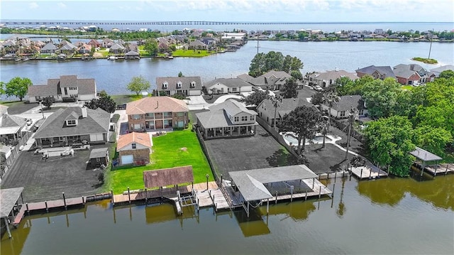 aerial perspective of suburban area featuring a large body of water