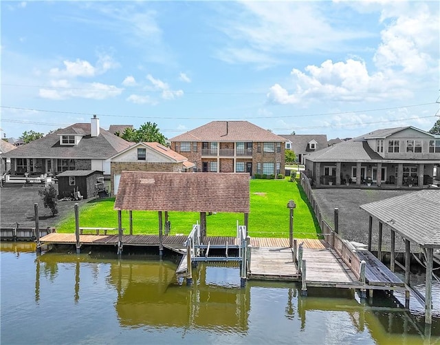 dock featuring boat lift, a water view, and a residential view