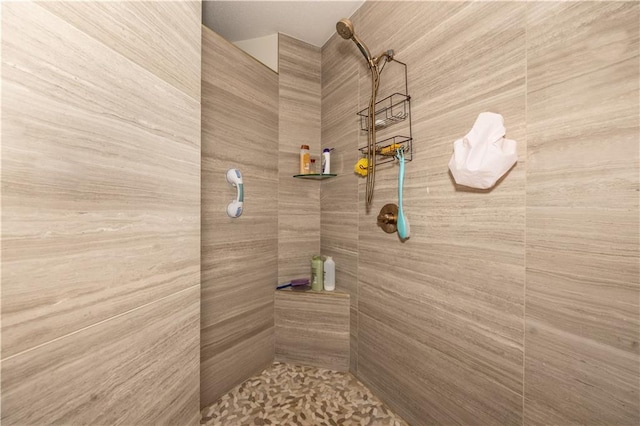 bathroom with tiled shower
