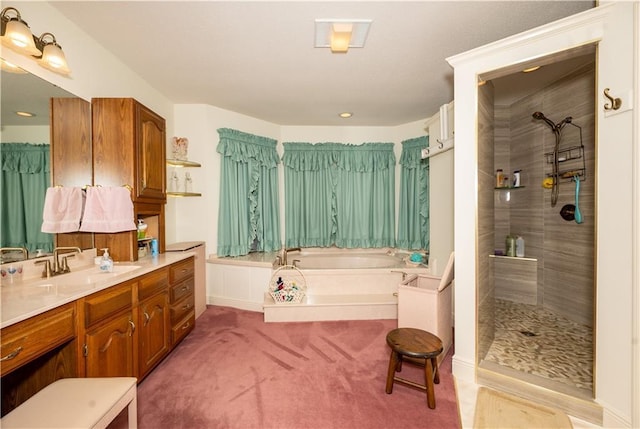 bathroom with tiled shower, a garden tub, and vanity