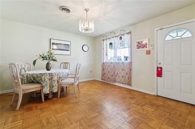 609 N Starrett Rd, Metairie, LA 70003 - dining space with a chandelier and plenty of natural light