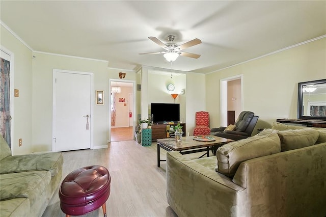 609 N Starrett Rd, Metairie, LA 70003 - living area with ornamental molding, a ceiling fan, and light wood-style flooring