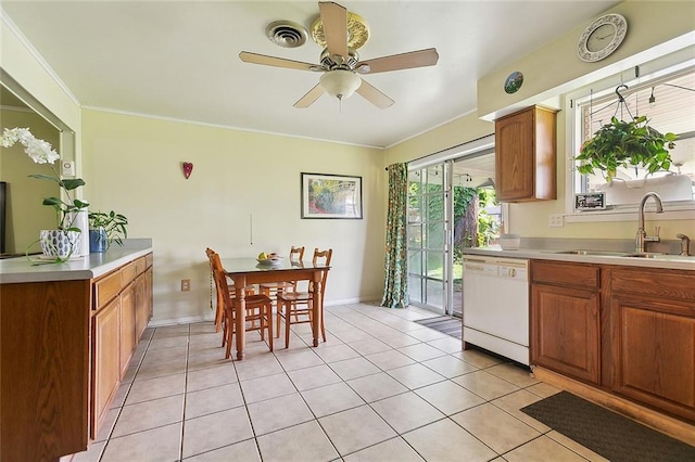 609 N Starrett Rd, Metairie, LA 70003 - kitchen with dishwasher, light countertops, a ceiling fan, light tile patterned flooring, and brown cabinets